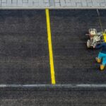 Equipment used for parking lot maintenance in a large outdoor area