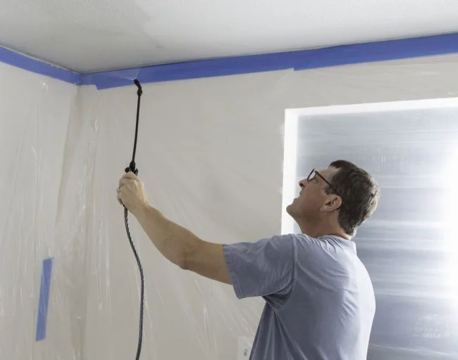 Popcorn ceilings, also known as acoustic or cottage cheese ceilings, were popular in the mid-20th century for their sound-dampening properties and inexpensive installation