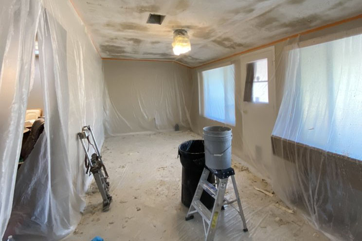 DIY popcorn ceiling removal involves scraping off the texture